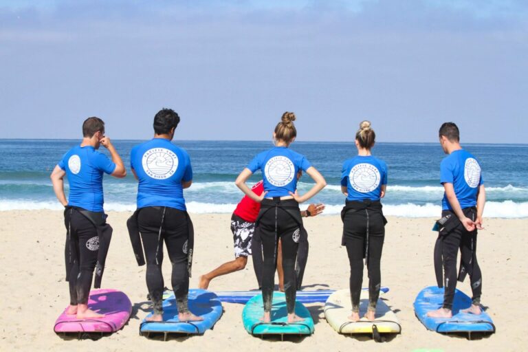 A group of 5 kids attending a group surf lesson in San Diego with Pacific Surf School.