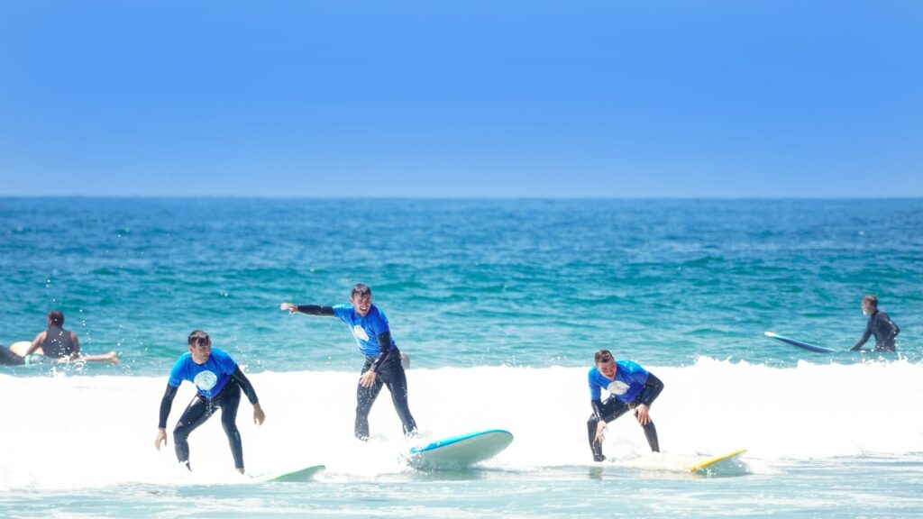 Surfers experiencing the best surf lessons in Southern California.