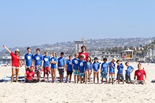 Group of kids enjoying surf camp in San Diego