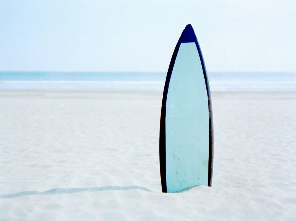 gun board surf board in the sand