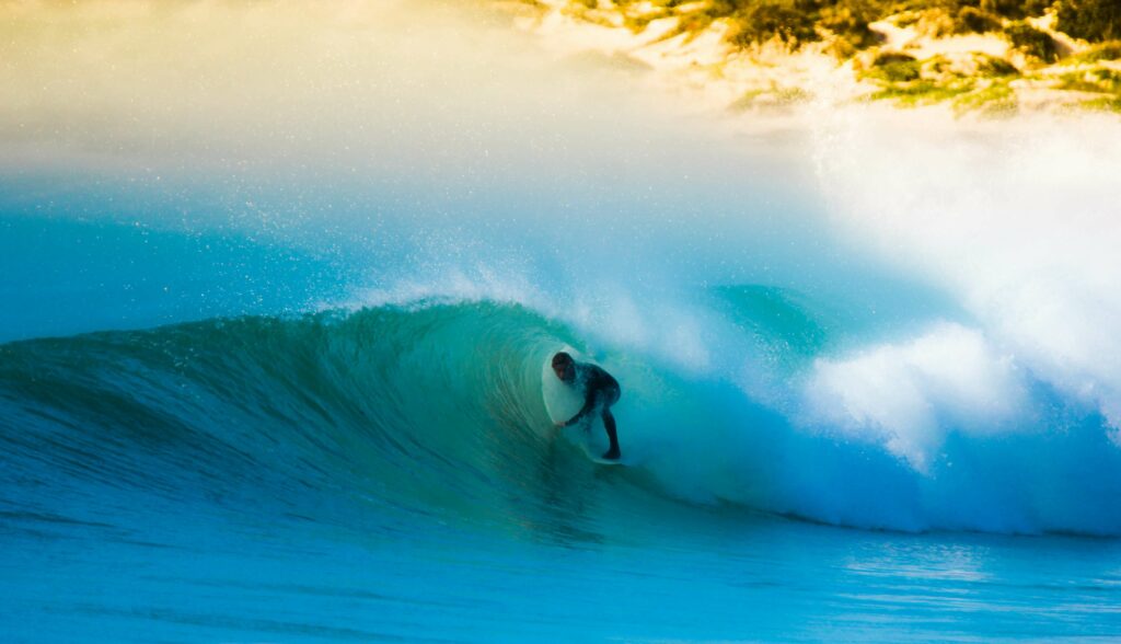 Surfer getting barreled on a big wave