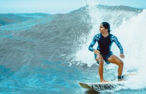 Woman surfing in a wave pool
