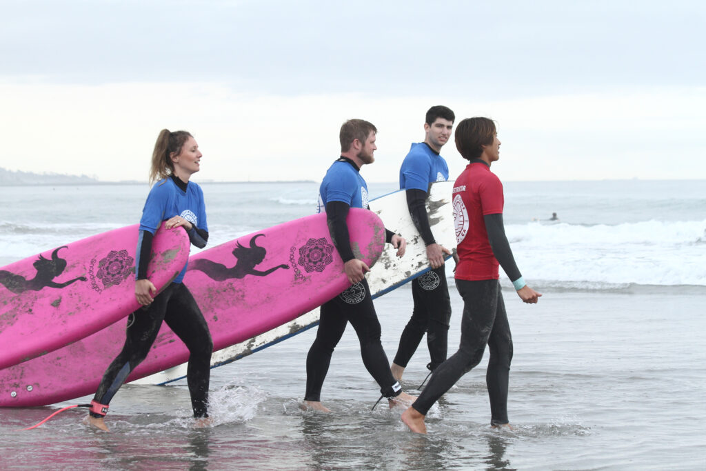 Students in a group surf lesson.