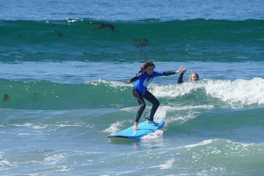Student learning to surf and their lesson for life to enjoy the moment 